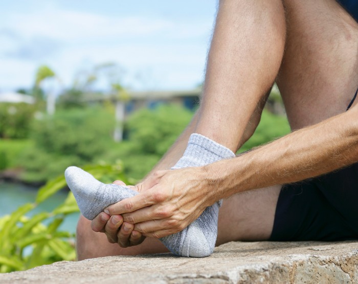 Man Experiencing Metatarsal Pain after a walk