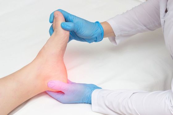 Doctor examining patient's foot for pain - Southern Delaware Foot and Ankle